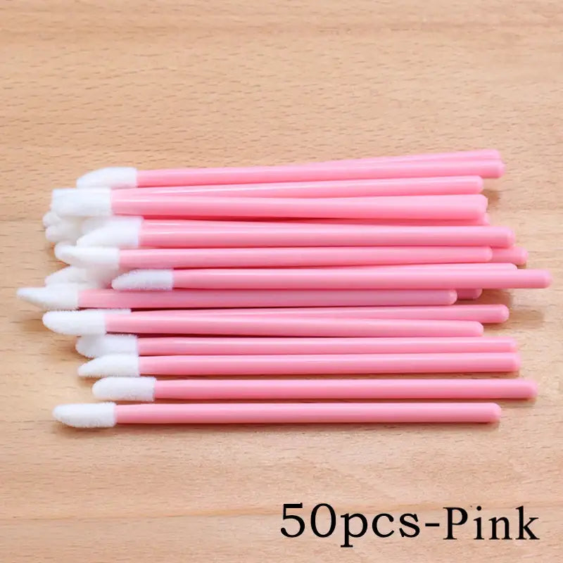 Pink lip gloss applicators.