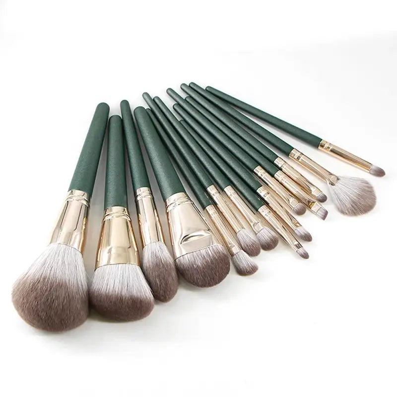 Set of green-handled makeup brushes.