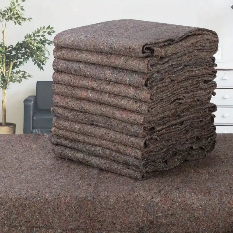 Stack of brown moving blankets.
