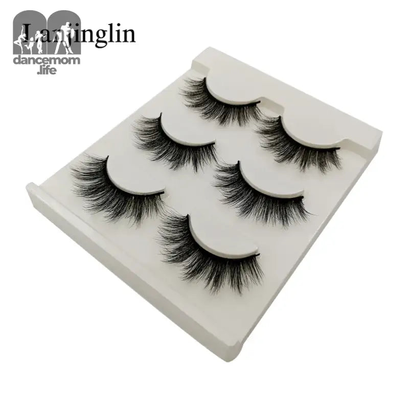 False eyelashes on a white tray.