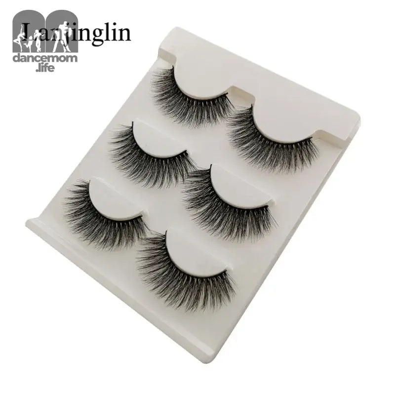 False eyelashes on a white tray.