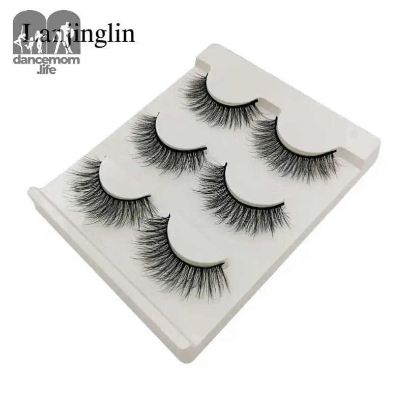 False eyelashes on a white tray.