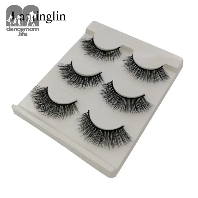 False eyelashes on a white tray.