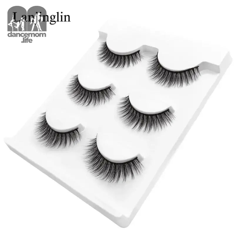 False eyelashes on a white tray.