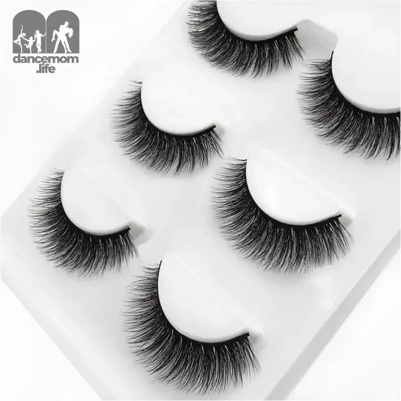 False eyelashes on a white tray.