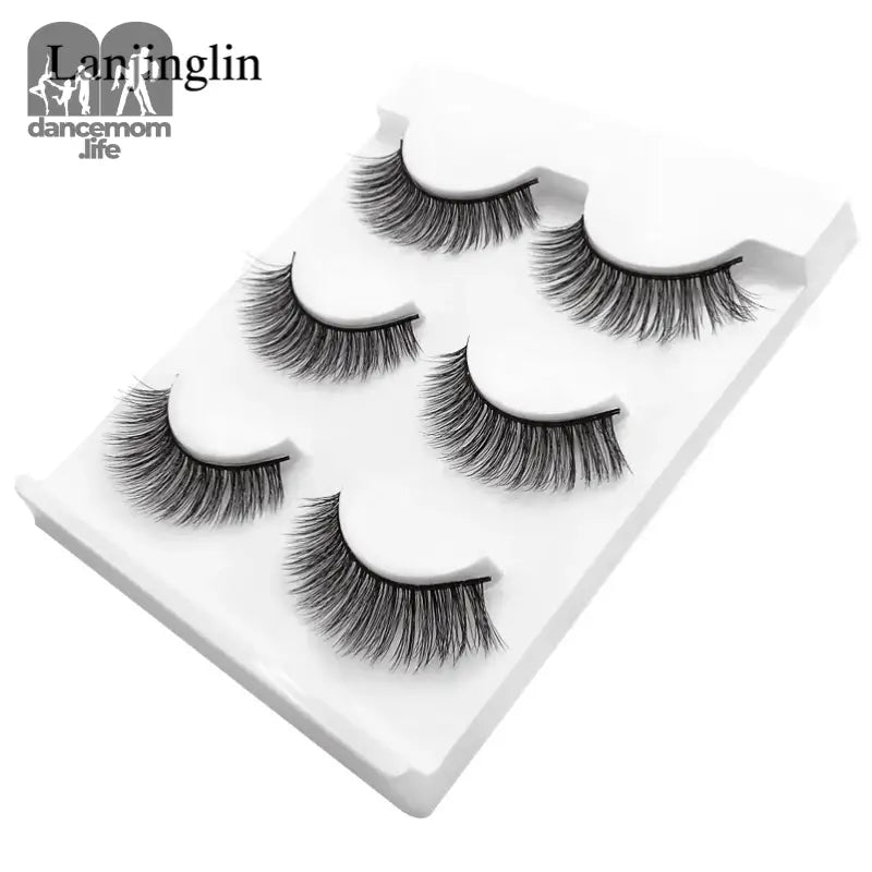 False eyelashes on a white tray.