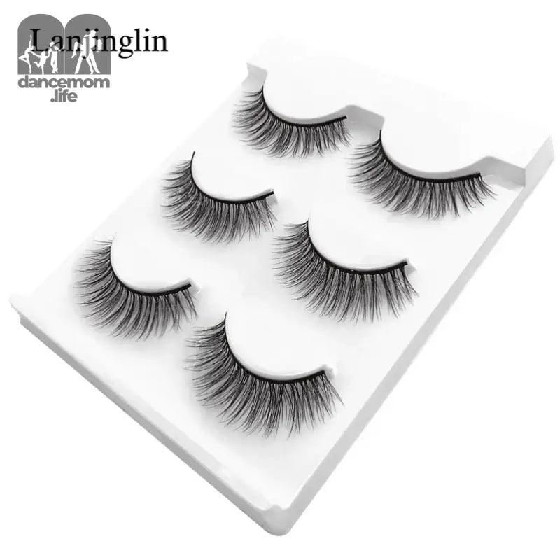 False eyelashes on a white tray.