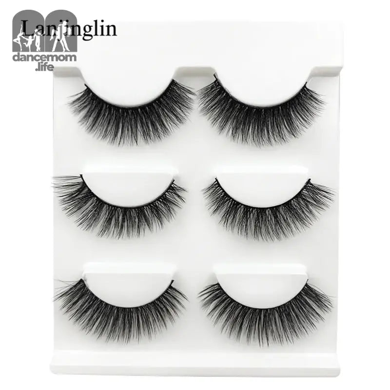 False eyelashes on a white tray.