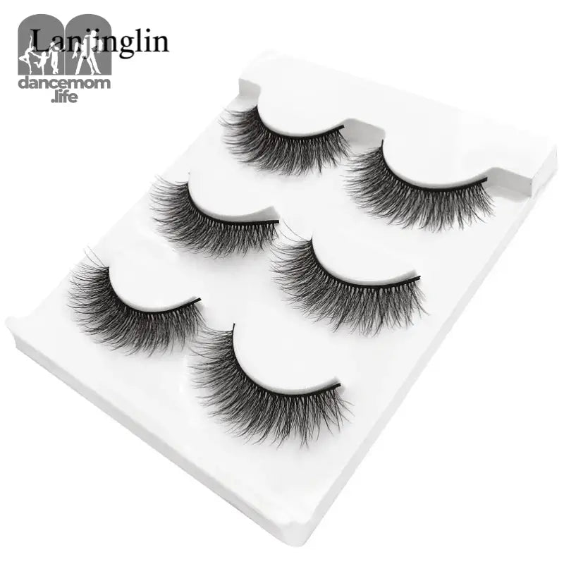 False eyelashes on a white tray.