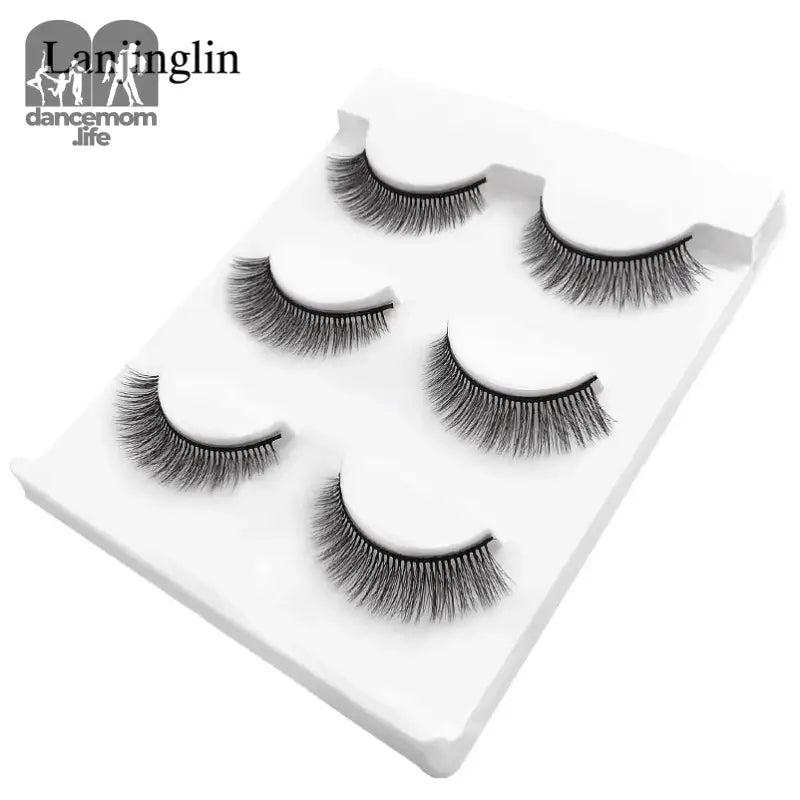 False eyelashes on a white tray.