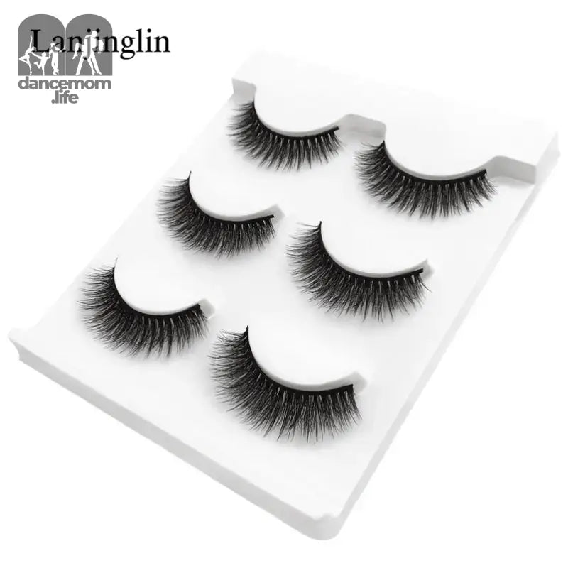 False eyelashes on a white tray.