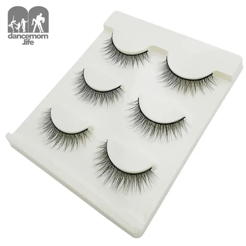 False eyelashes on a white tray.