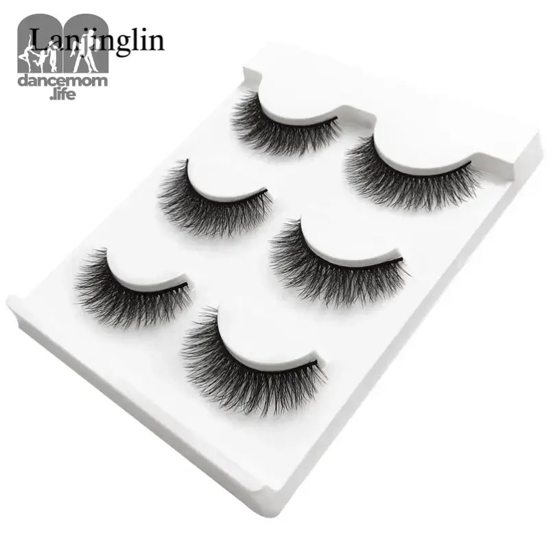 False eyelashes on a white tray.