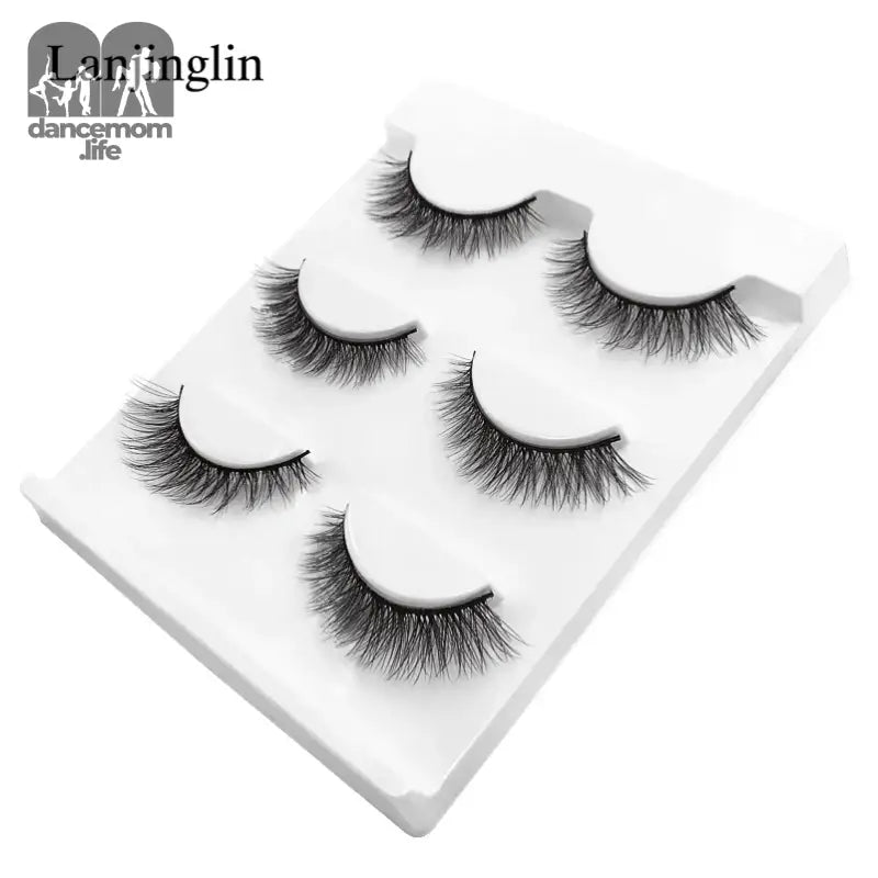 False eyelashes on a white tray.
