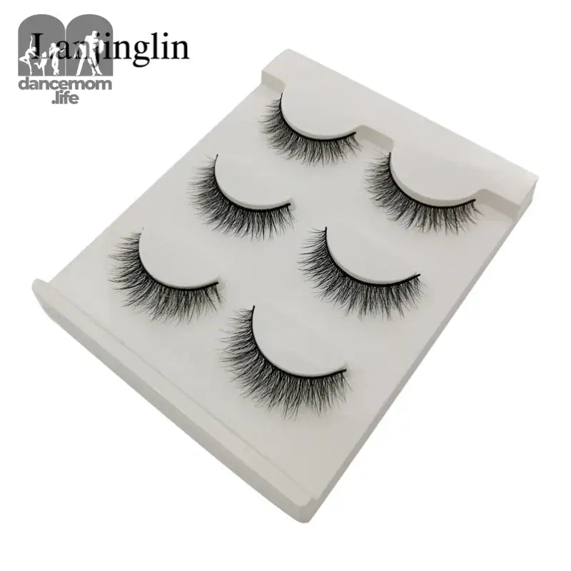False eyelashes on a white tray.