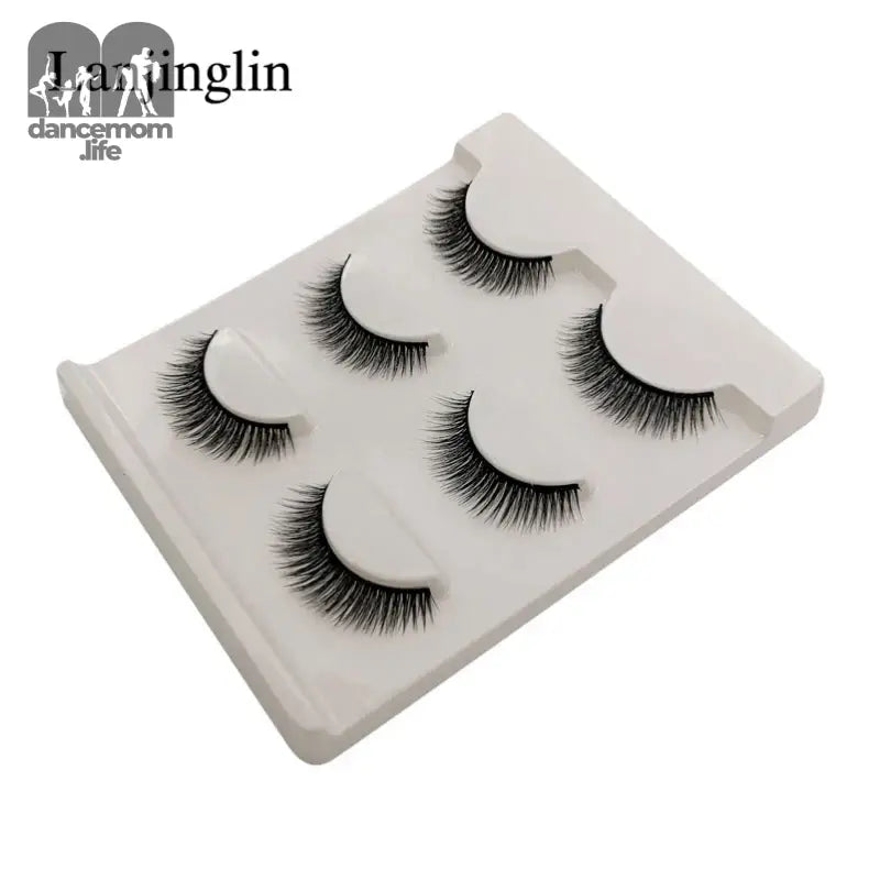False eyelashes on a white tray.