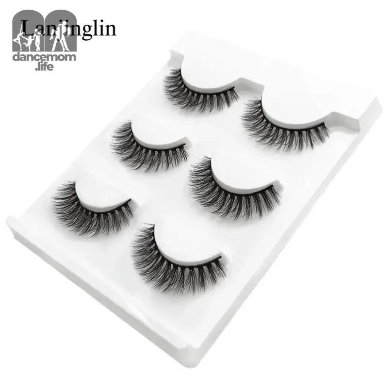 False eyelashes on a white tray.