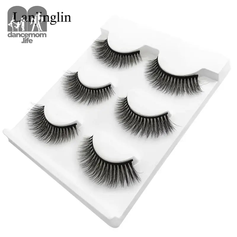 False eyelashes on a white tray.