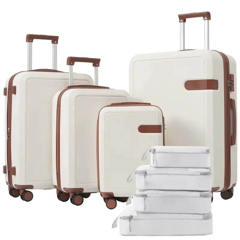 Ivory luggage set with brown accents.
