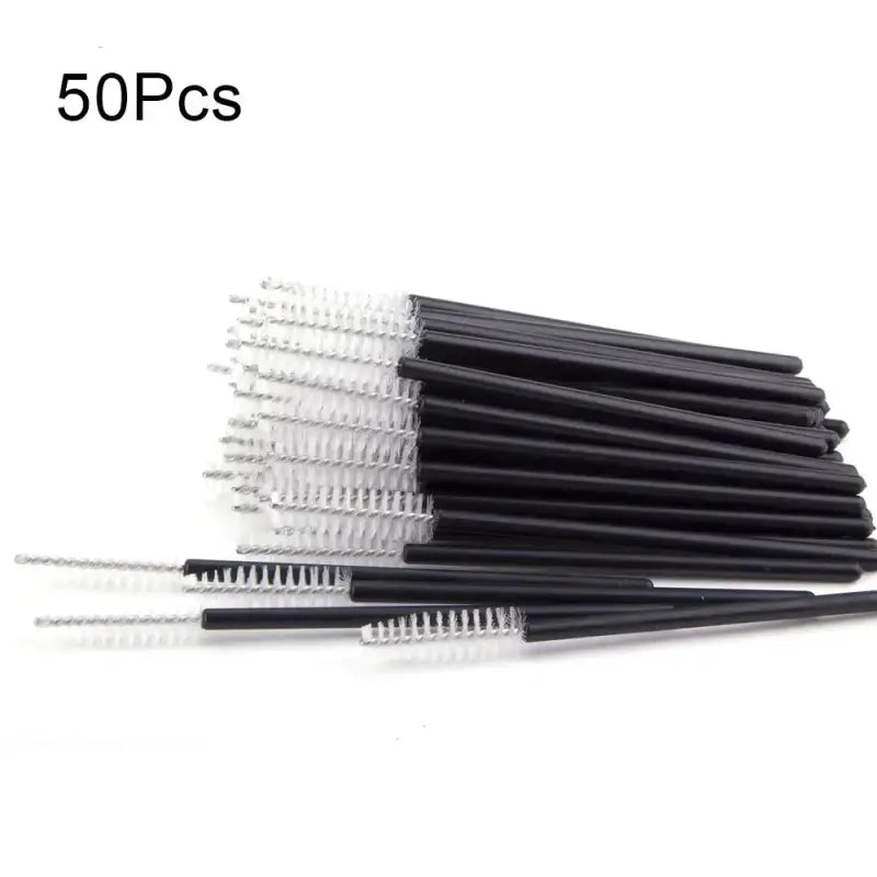 Pile of black-handled interdental brushes.