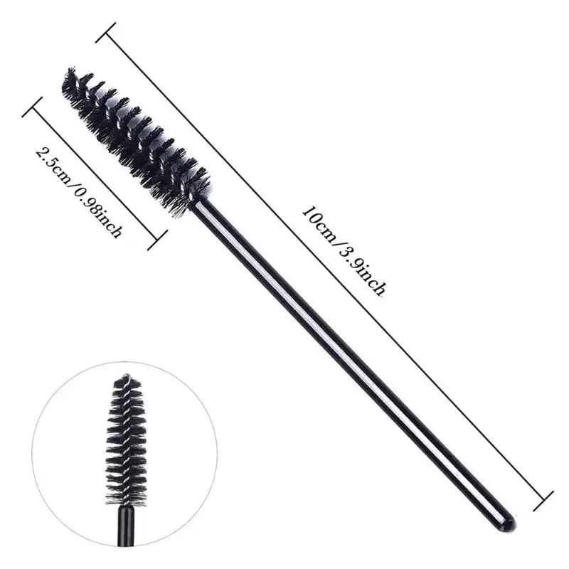 Black mascara wand with measurements.