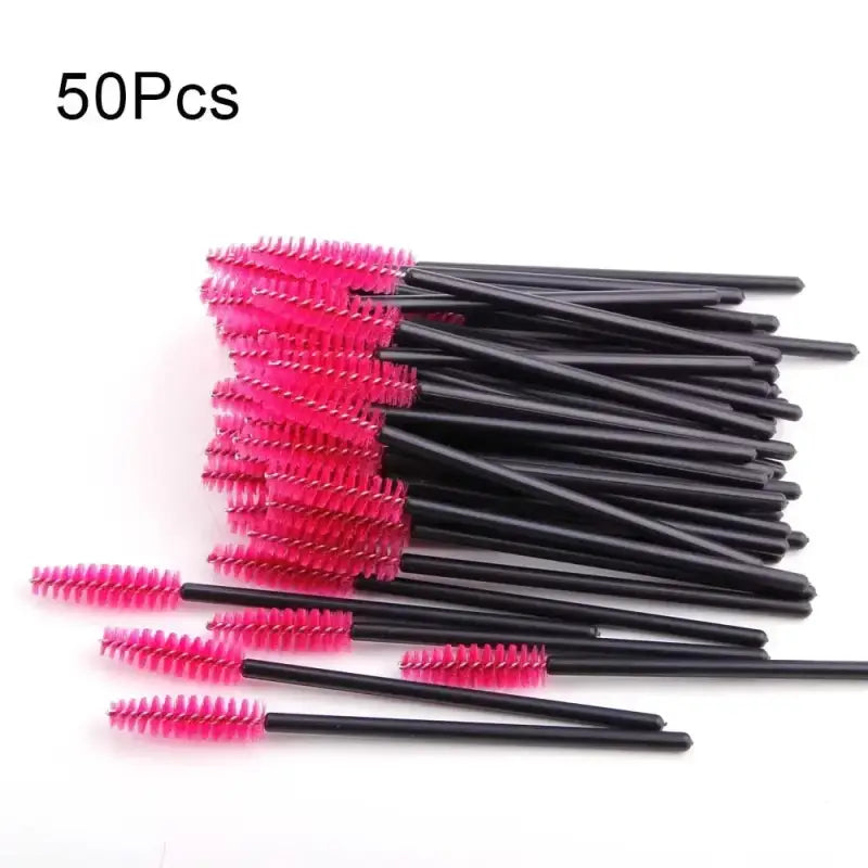 Pink mascara wands with black handles.