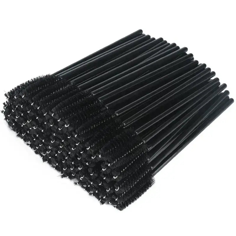 Pile of black mascara wands.