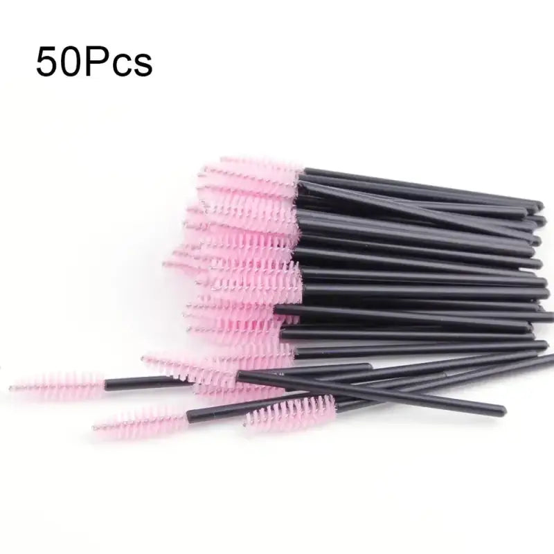 Pink-bristled mascara wands with black handles.