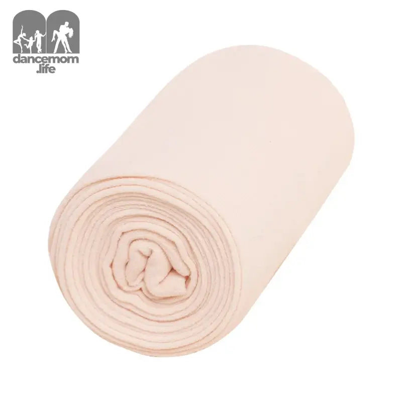 Rolled light pink fabric or textile material.