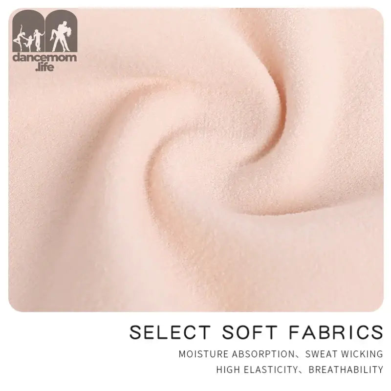 Pale pink fabric with gentle swirling folds showing its soft texture.