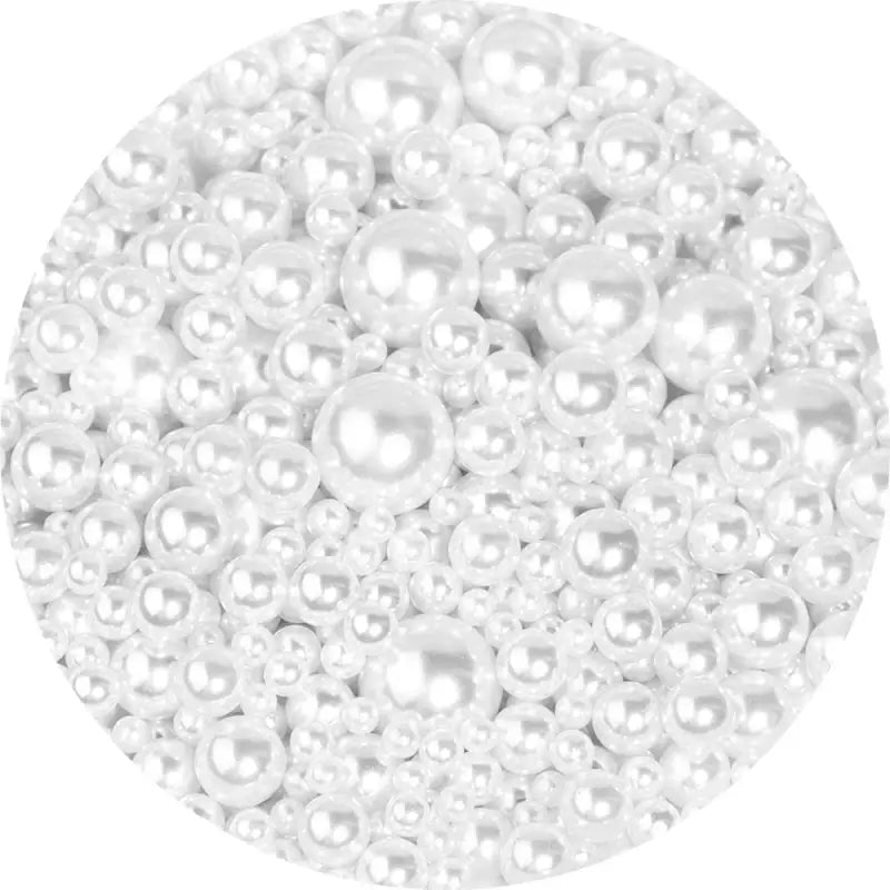 White pearl beads clustered together in a circular arrangement.
