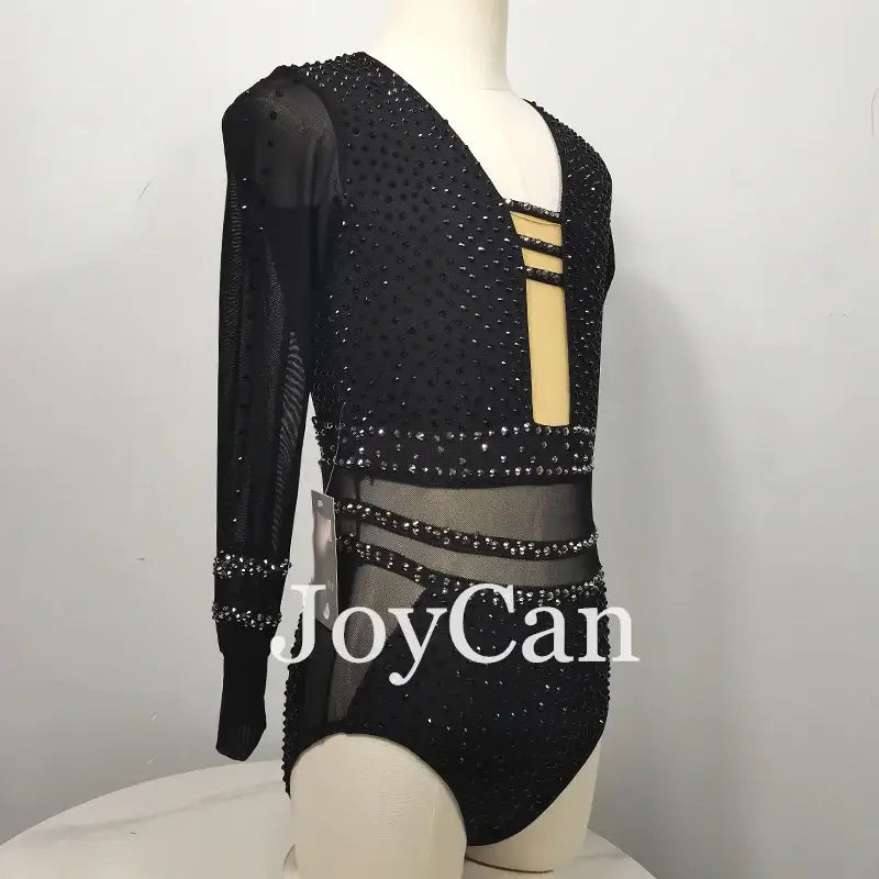 Black sparkly long-sleeved gymnastics leotard with mesh cutout details.