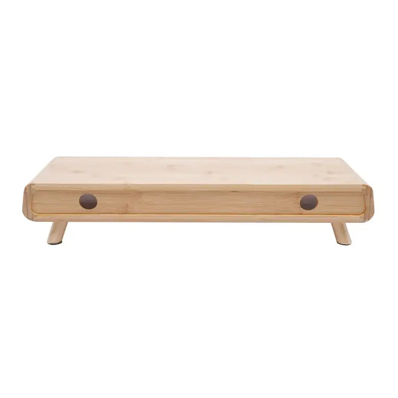 Light-colored wooden monitor stand with rounded edges.
