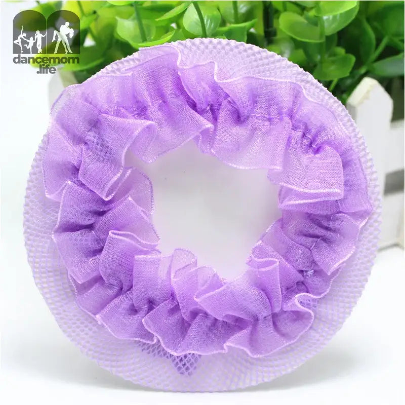 Purple ruffled mesh hair scrunchie with a circular shape.