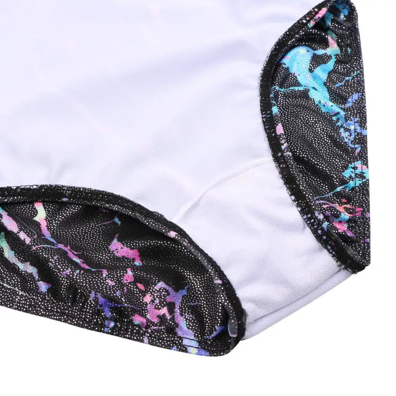 White fabric with black lace trim featuring iridescent blue, pink and purple accents.