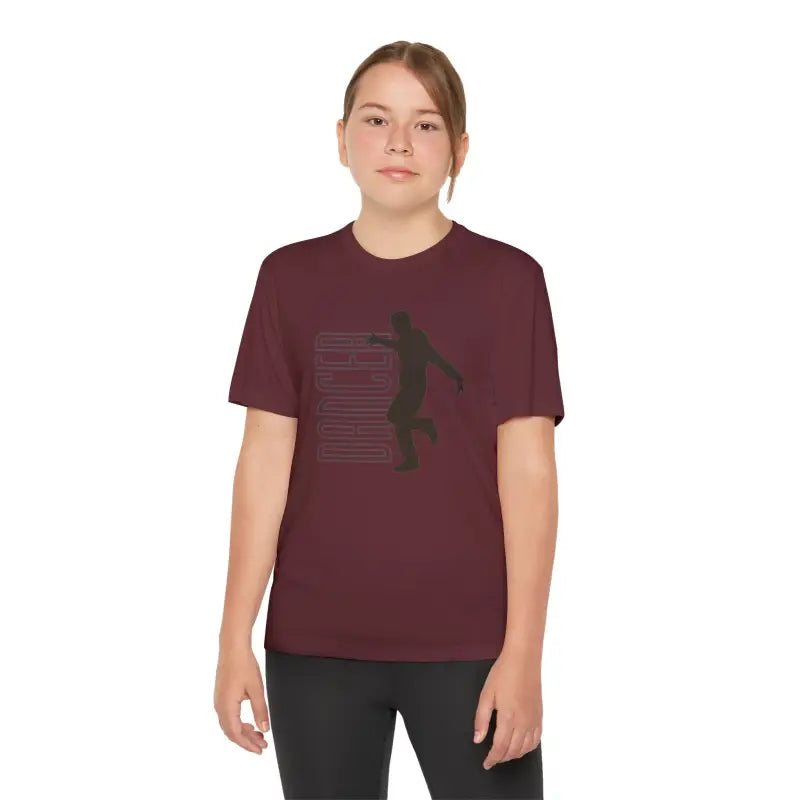 Burgundy t-shirt with a basketball player silhouette graphic design.