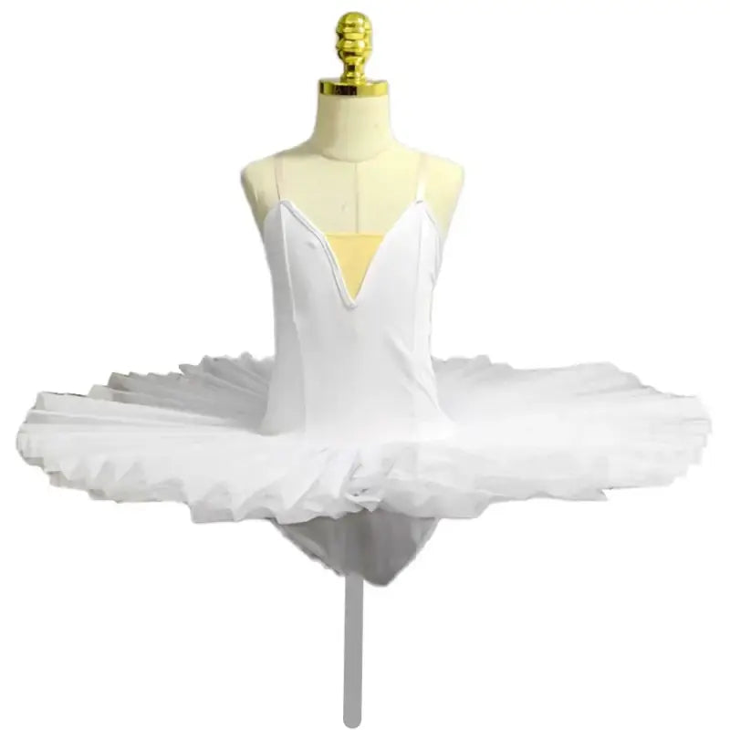 White classical ballet tutu with spaghetti straps and a stiff pancake-style skirt.