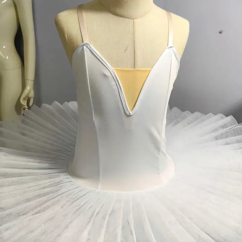 White classical ballet tutu with a plunging neckline bodice.
