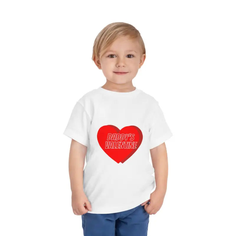 White t-shirt with a red heart design containing text ’Daddy’s Valentine’