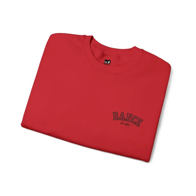 Red t-shirt with ’DANCE’ text embroidered on the chest.
