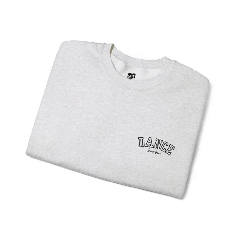White t-shirt with ’DANCE’ text printed on it.