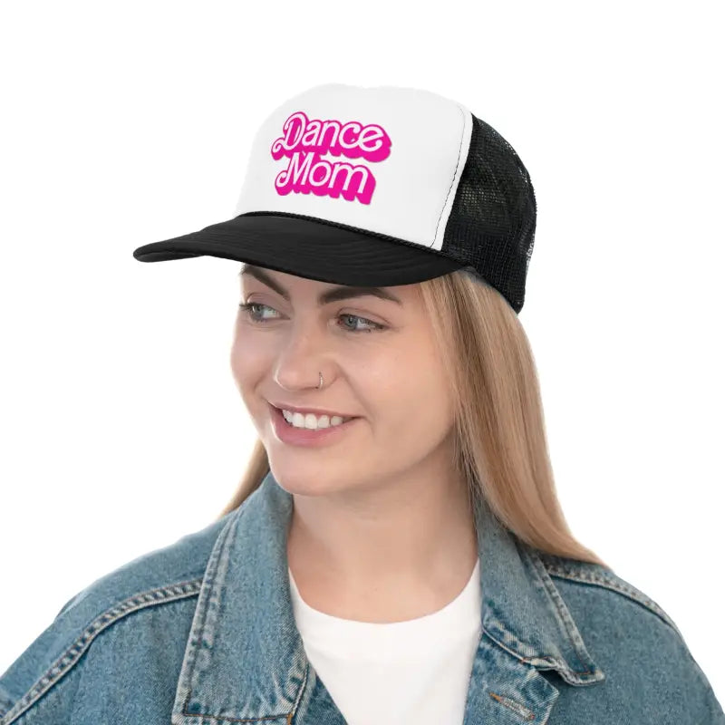 Black and white trucker hat with pink ’Dance Mom’ text on the front panel.