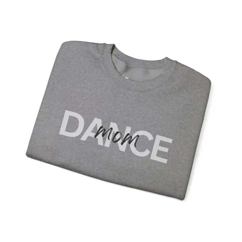 Grey folded t-shirt with ’DANCE mom’ text printed in white and black.