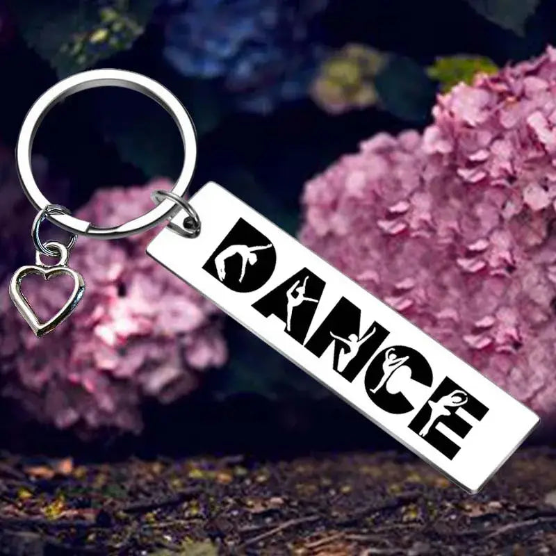 Dance-themed keychain with heart charm.