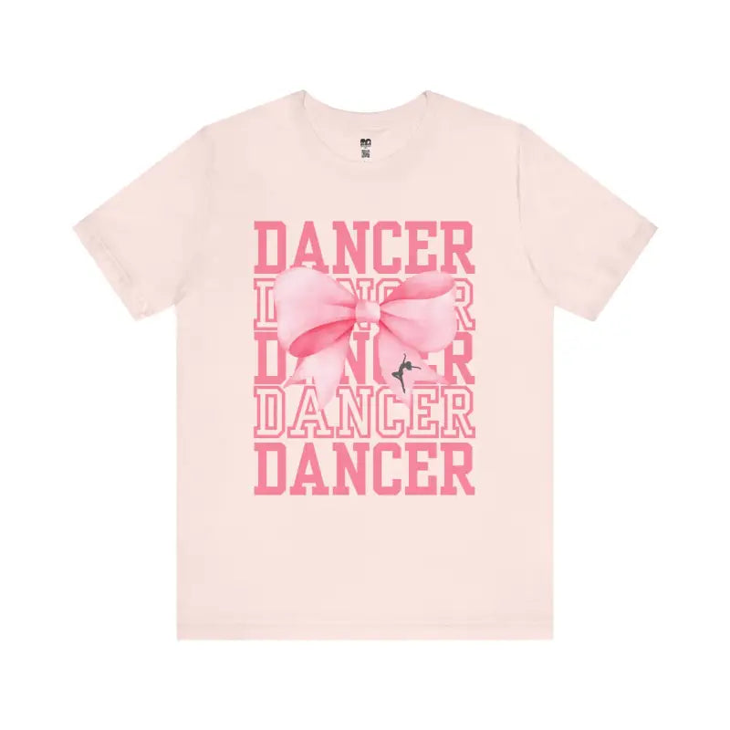 Pink t-shirt with ’DANCER’ text and bow design printed in coral pink.