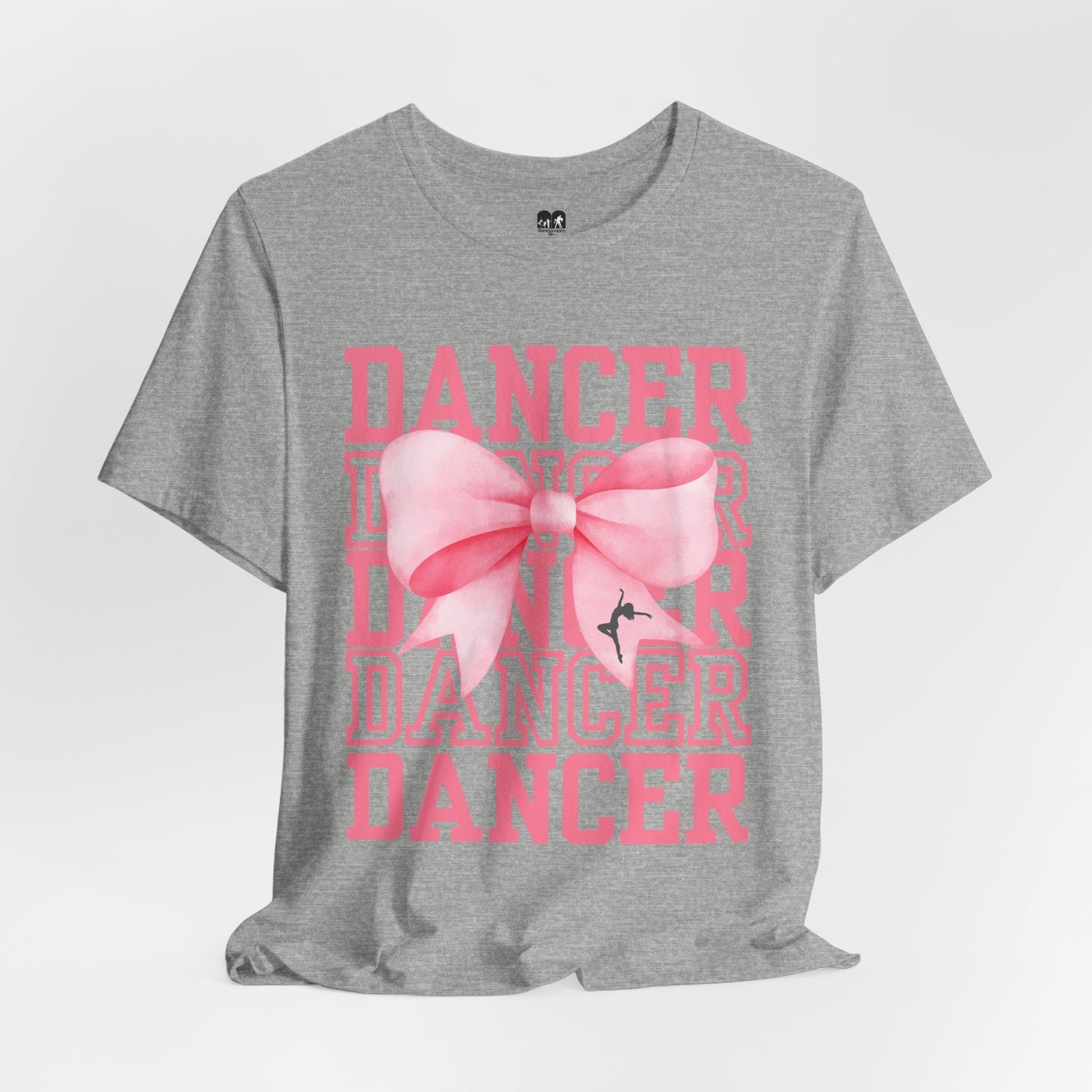 Gray heathered cotton t-shirt featuring a bold pink bow graphic with the word ’dancer’ repeated in stacked, faded pink lettering.