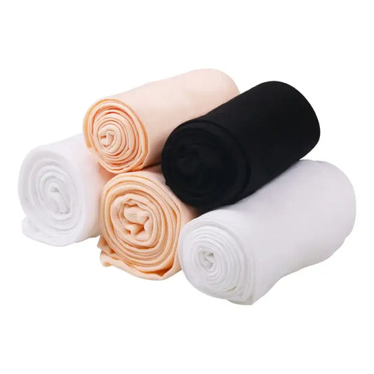Rolled fabric pieces in white, peach, and black colors.