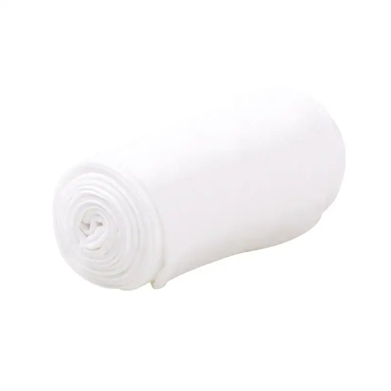 White rolled-up towel or cloth material.
