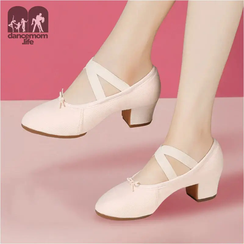 Pink heeled dance shoes.