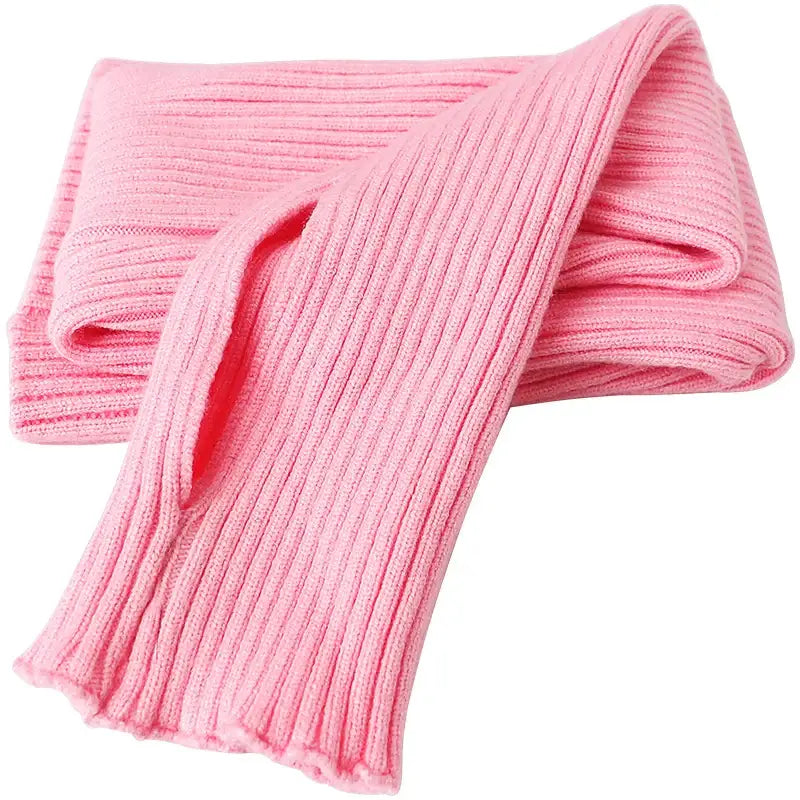 Pink ribbed knit scarf with vertical ridges.